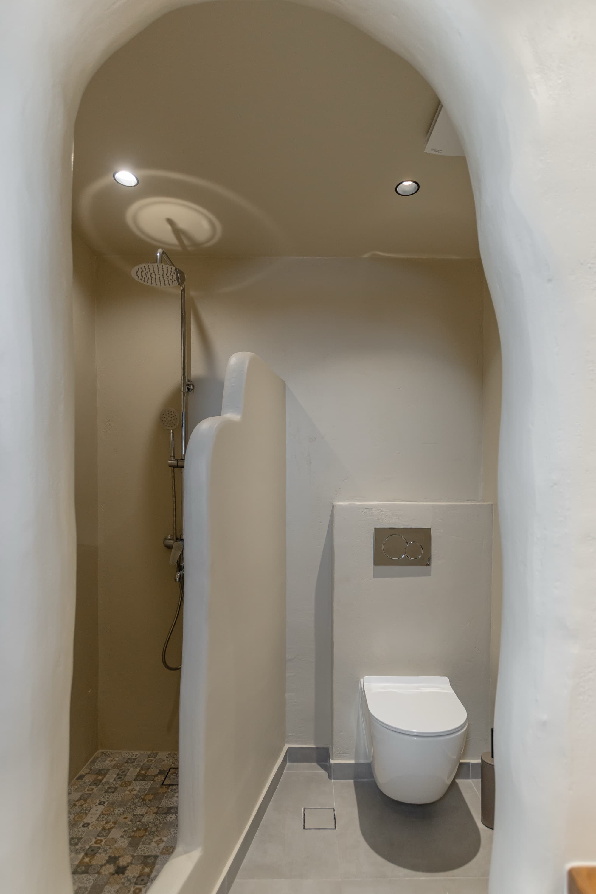 Bathroom with vessel sink on wooden counter and illuminated mirror